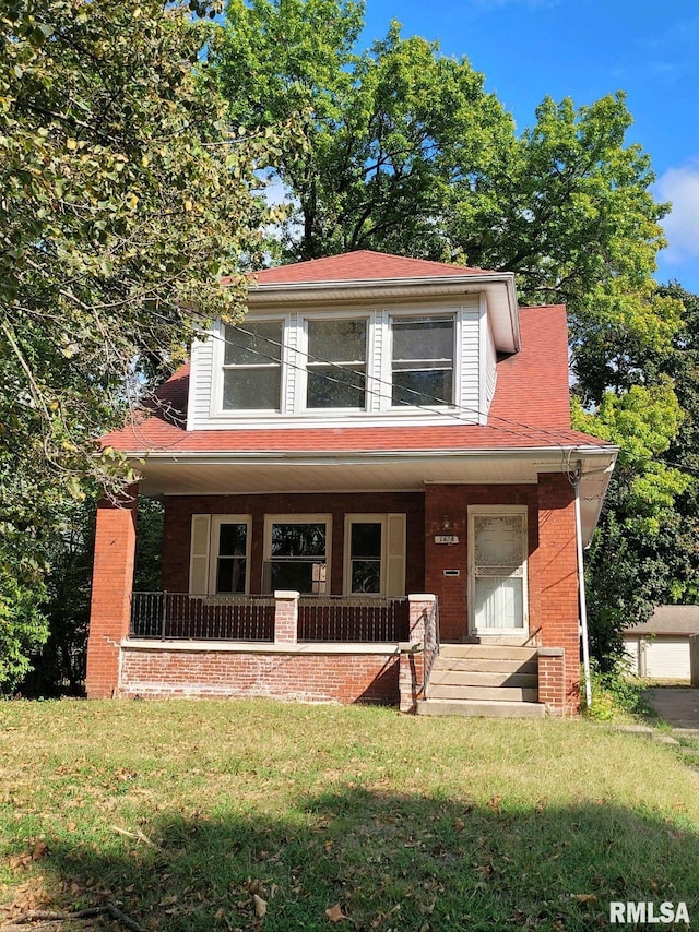 view of front of house with a front lawn and a porch