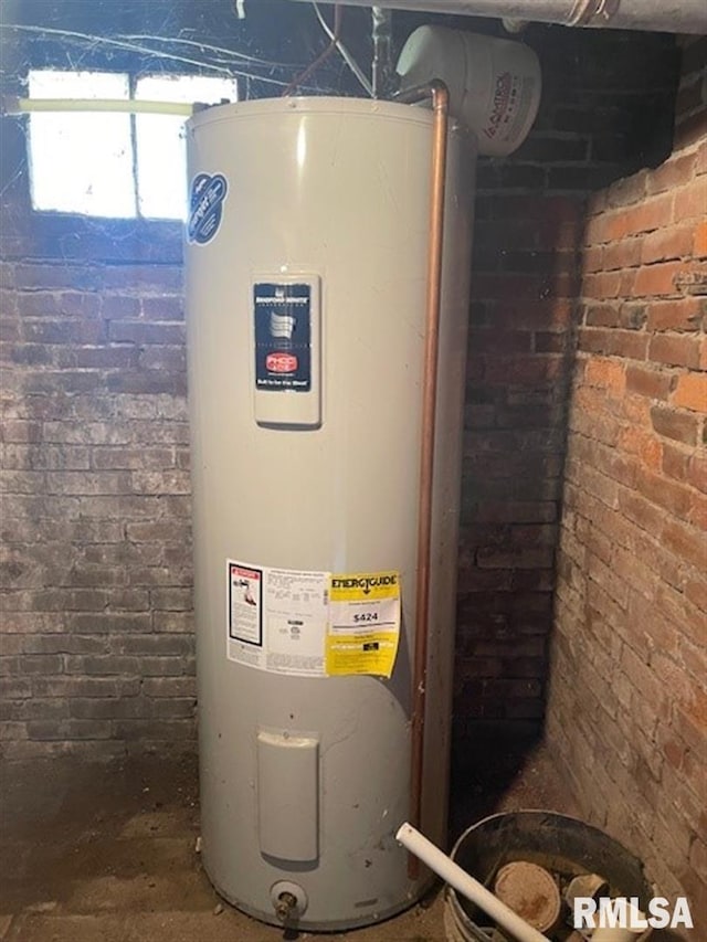 utility room with electric water heater