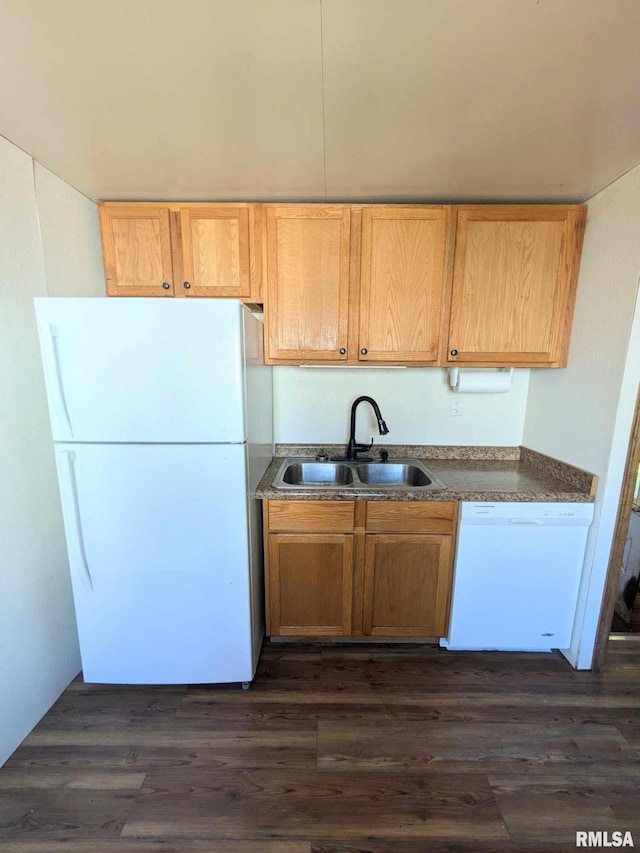 kitchen with dark wood-type flooring, sink, and white appliances