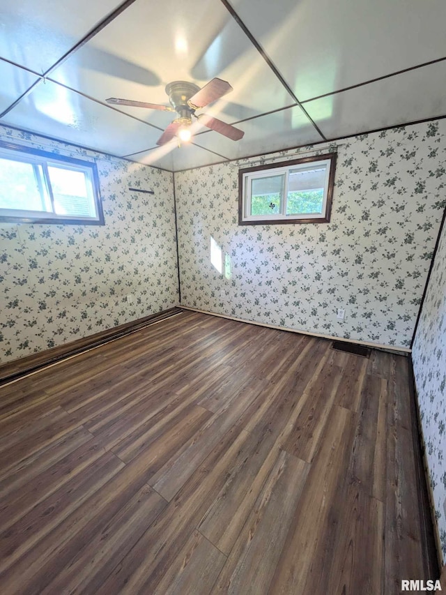 interior space with ceiling fan and dark hardwood / wood-style floors