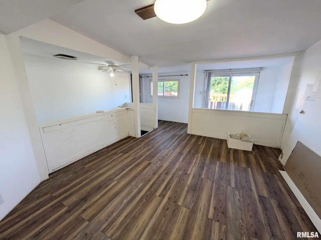 unfurnished room featuring vaulted ceiling, ceiling fan, and dark wood-type flooring