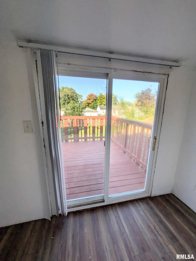 doorway with dark hardwood / wood-style flooring