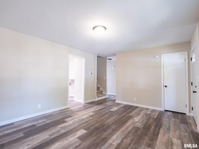 unfurnished room featuring dark hardwood / wood-style floors