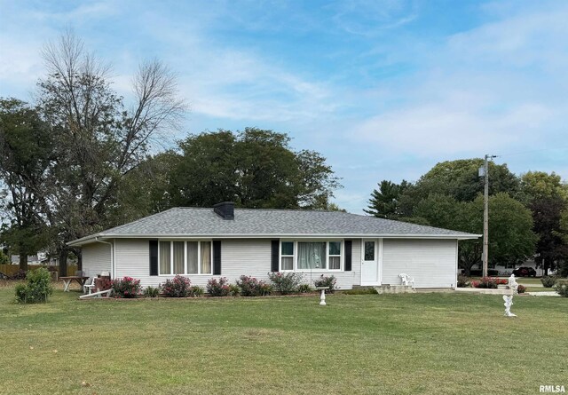 ranch-style home with a front lawn