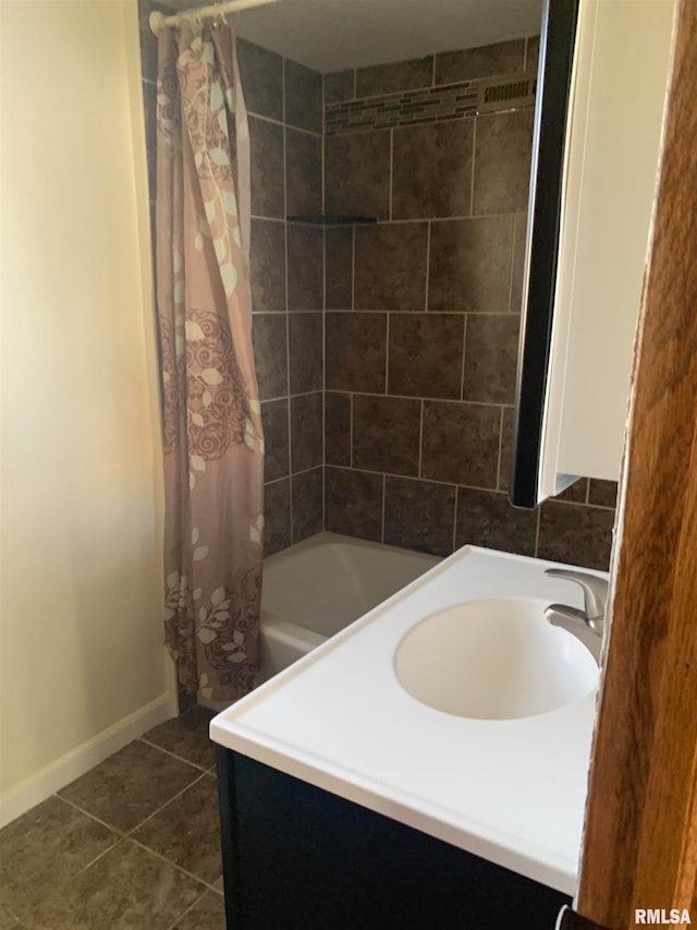 bathroom featuring vanity, shower / tub combo with curtain, and tile patterned floors