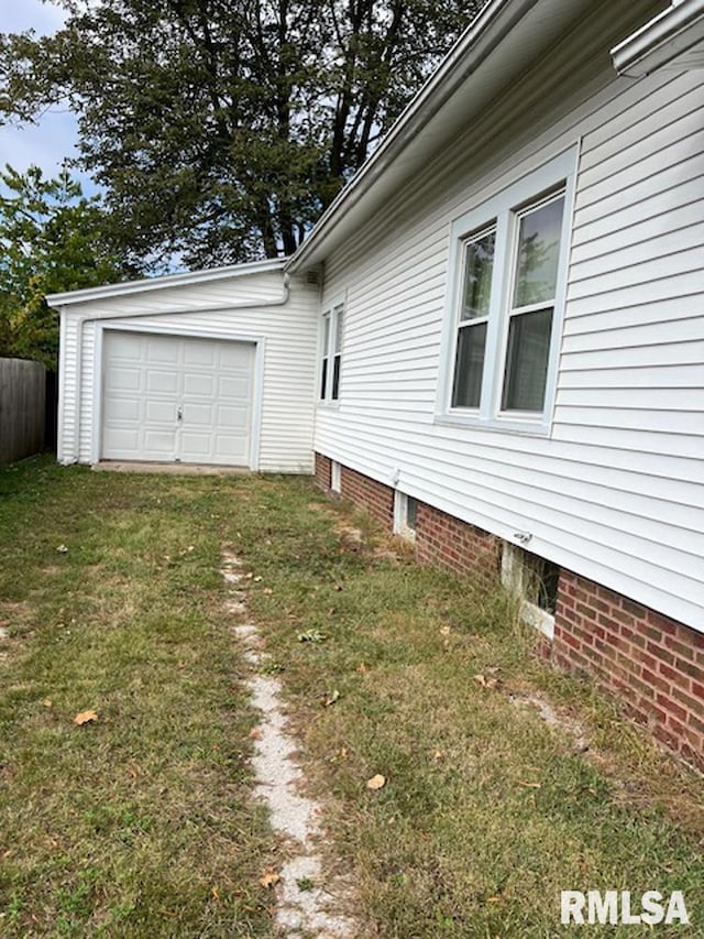 view of property exterior with a lawn and a garage