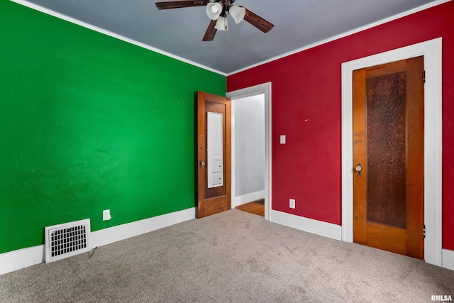 unfurnished bedroom with ceiling fan and carpet