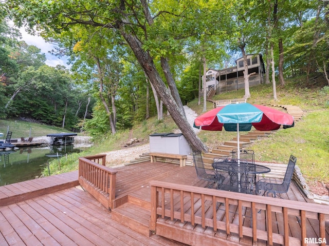 wooden deck with a water view