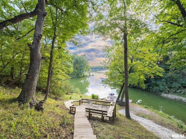 surrounding community with a water view