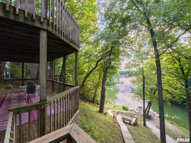 wooden deck featuring a water view