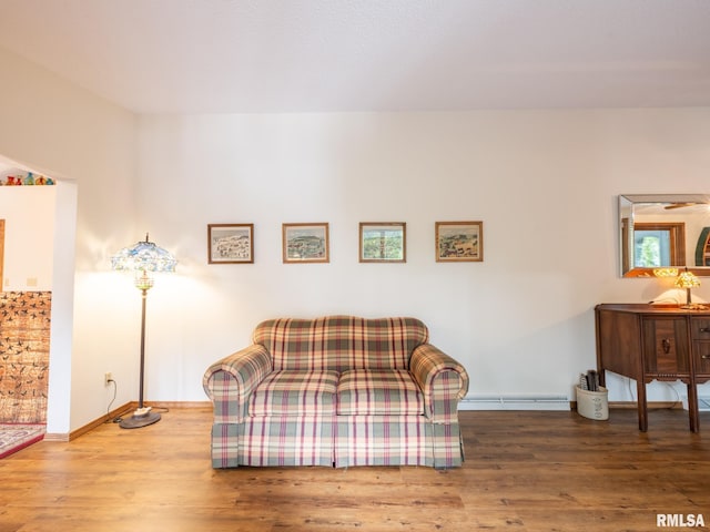 sitting room with hardwood / wood-style flooring