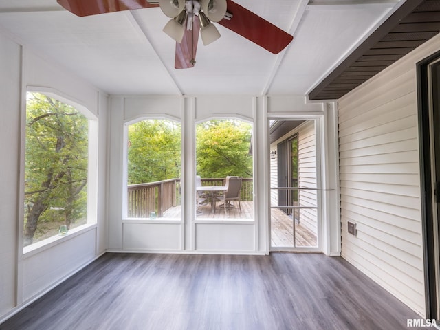 unfurnished sunroom featuring ceiling fan and a healthy amount of sunlight