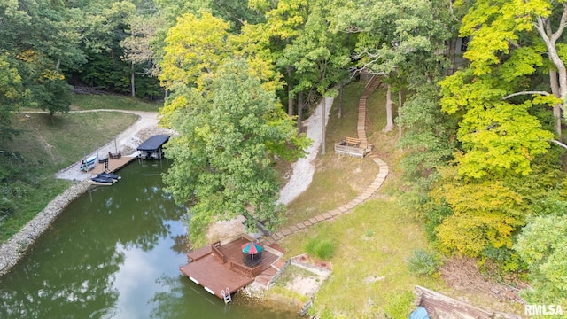 birds eye view of property with a water view