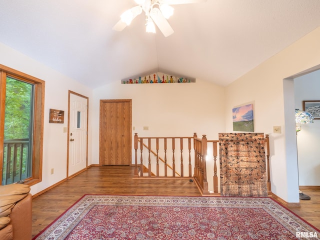 entryway featuring vaulted ceiling, ceiling fan, and hardwood / wood-style flooring