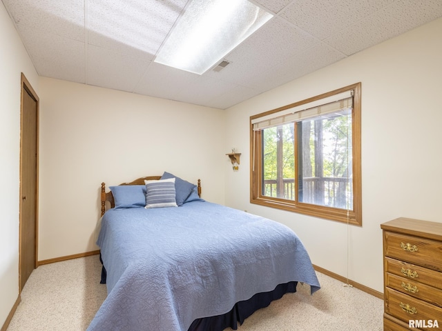 bedroom with light colored carpet