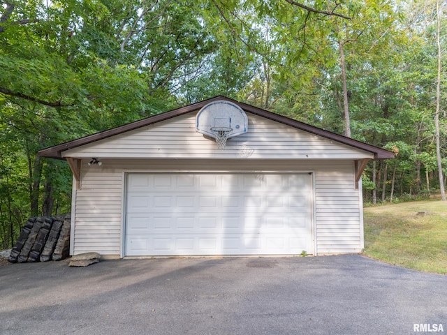 garage featuring wood walls