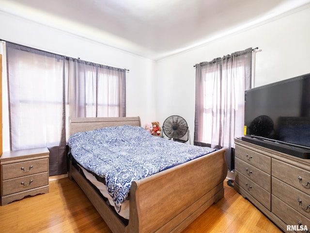 bedroom with light hardwood / wood-style flooring