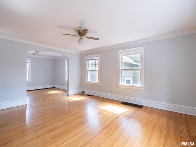 unfurnished room with ceiling fan, ornamental molding, and light hardwood / wood-style floors