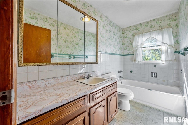 bathroom featuring tile walls, tile patterned flooring, a tub, vanity, and toilet