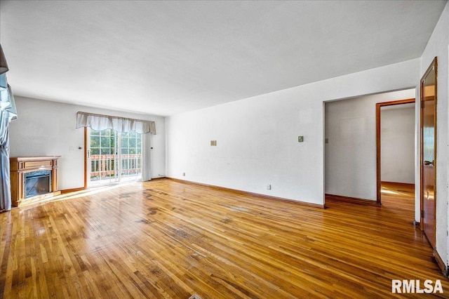 unfurnished living room with wood-type flooring