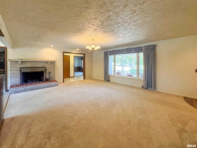 unfurnished living room with a brick fireplace, a textured ceiling, and carpet floors