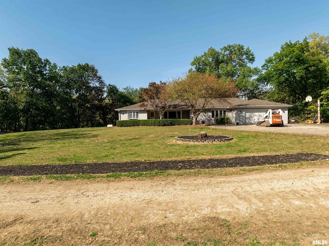 view of front of property with a garage and a front yard