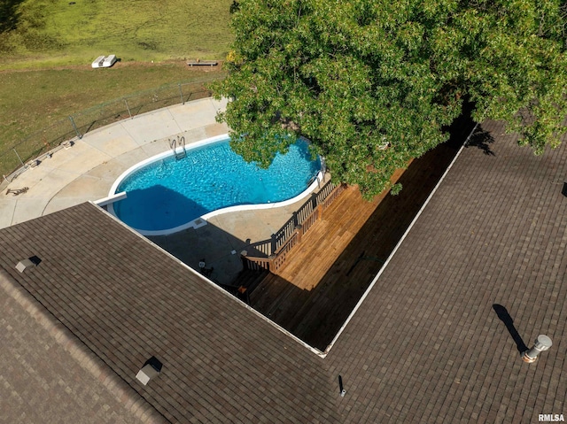 view of swimming pool with a patio