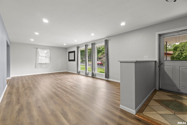 unfurnished room with wood-type flooring