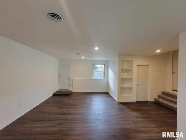 kitchen featuring sink, dark wood-type flooring, white cabinets, and appliances with stainless steel finishes