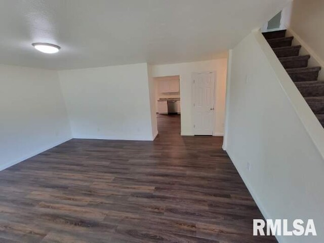 kitchen featuring white cabinetry, dark wood-type flooring, and stainless steel appliances