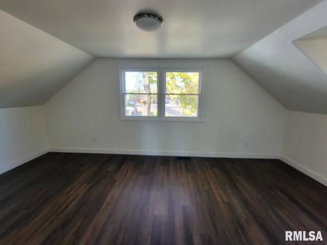 unfurnished living room featuring dark hardwood / wood-style flooring