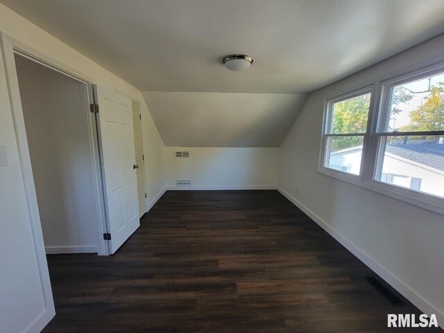 empty room with dark hardwood / wood-style floors