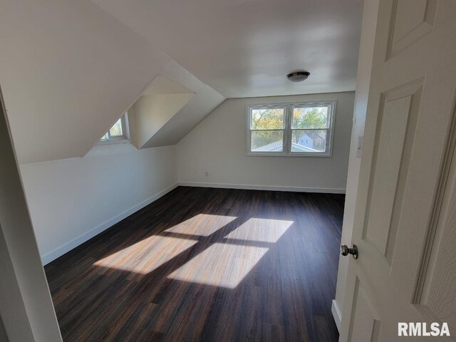 bathroom featuring an enclosed shower and wood-type flooring