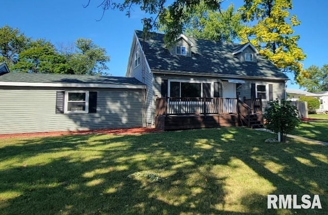 view of front of home featuring a wooden deck and a front yard