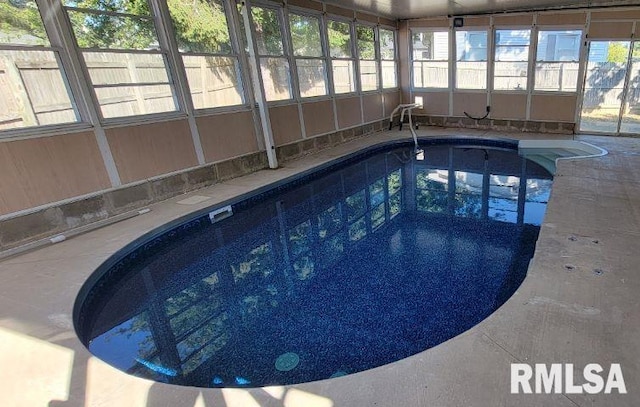 view of pool featuring a lanai