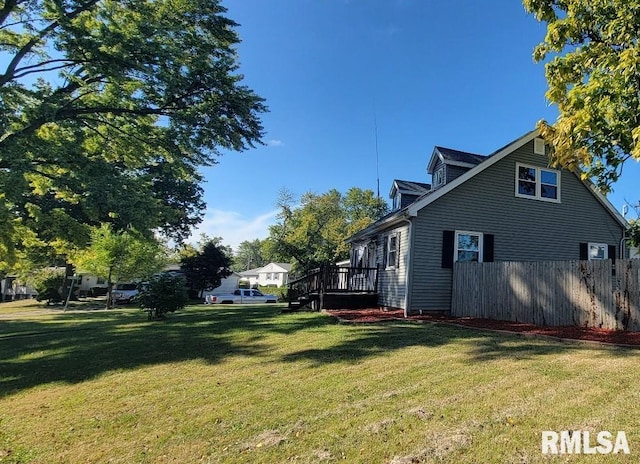 view of side of property featuring a lawn