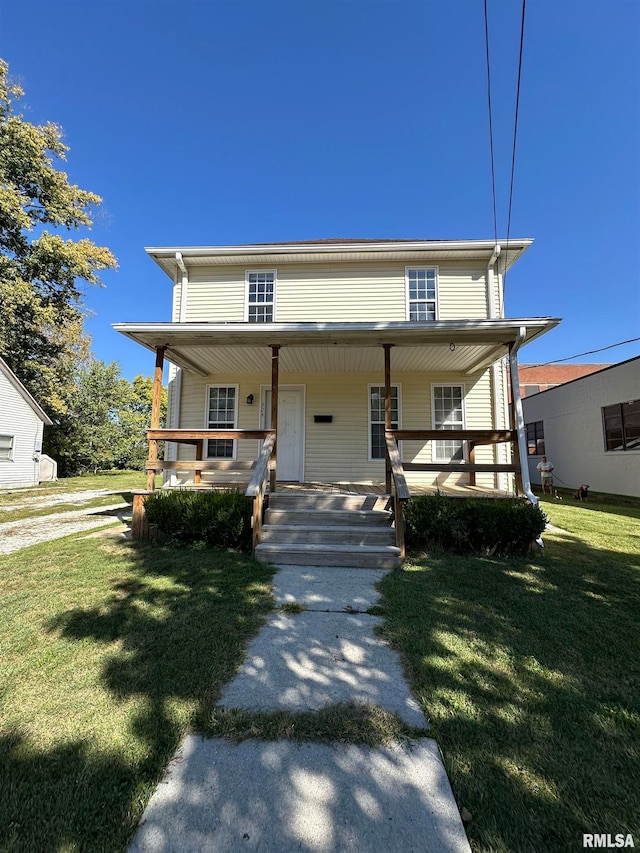 view of front of property with a front lawn and covered porch