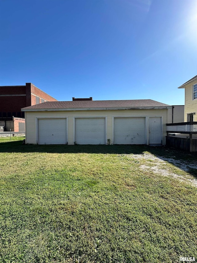 garage with a yard