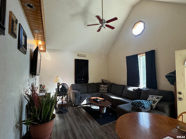 living room featuring ceiling fan, hardwood / wood-style flooring, and high vaulted ceiling