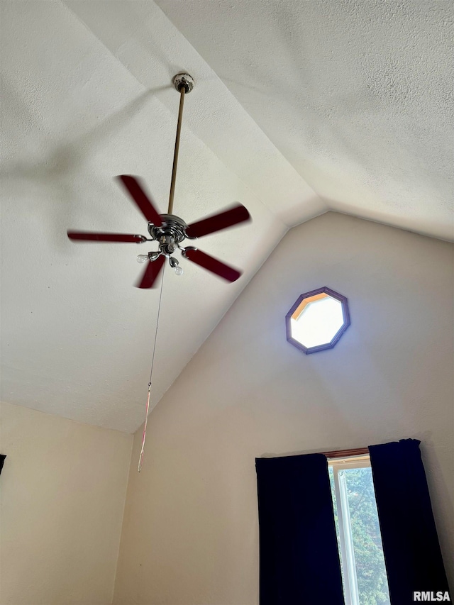 interior details featuring a textured ceiling and ceiling fan