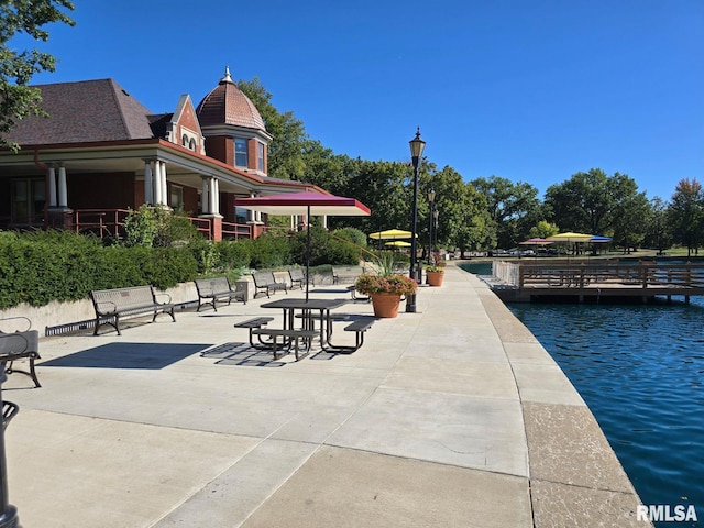 surrounding community featuring a water view