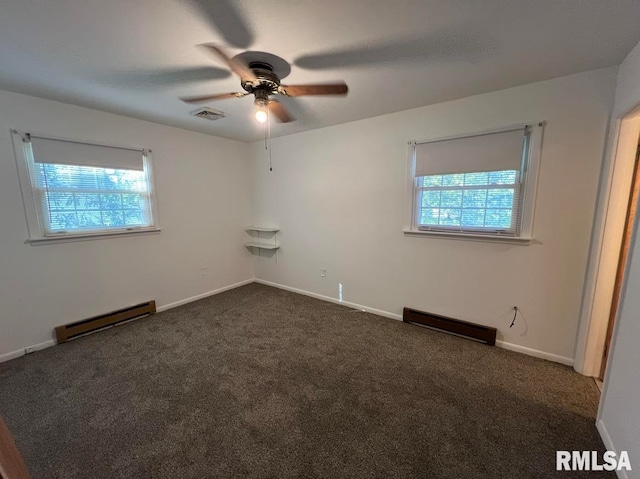 carpeted empty room featuring a baseboard radiator, ceiling fan, and plenty of natural light