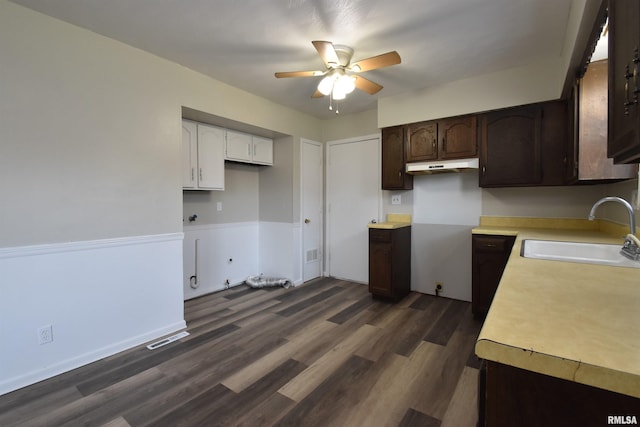 kitchen with ceiling fan, dark hardwood / wood-style flooring, dark brown cabinets, and sink