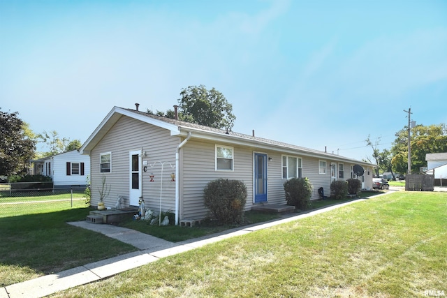 ranch-style home with a front yard