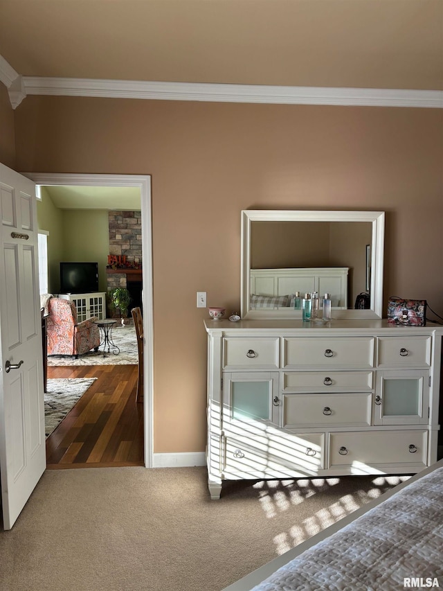 bedroom featuring ornamental molding and hardwood / wood-style floors