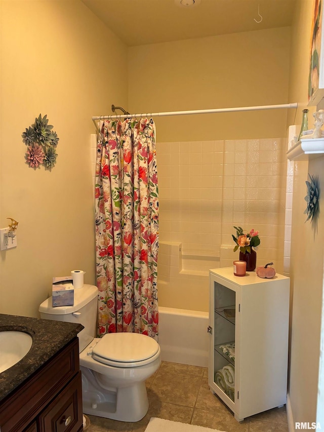 full bathroom featuring vanity, tile patterned floors, toilet, and shower / bath combo