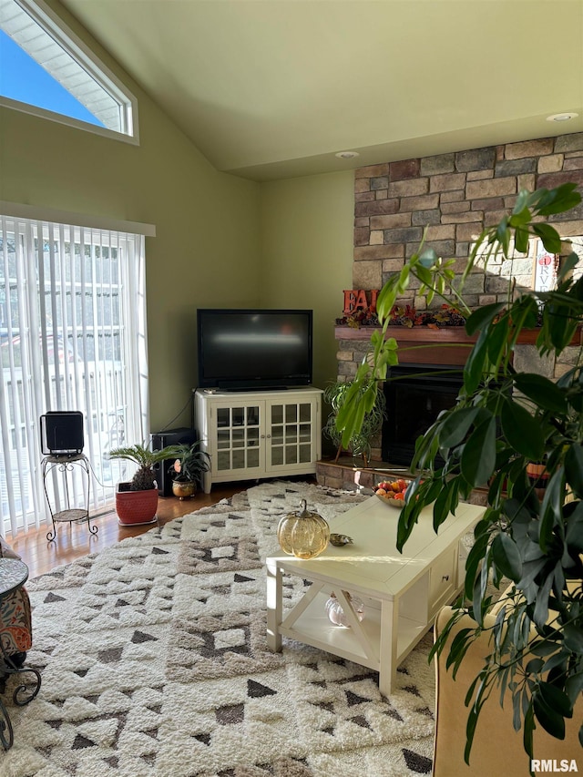 living room with lofted ceiling and hardwood / wood-style flooring