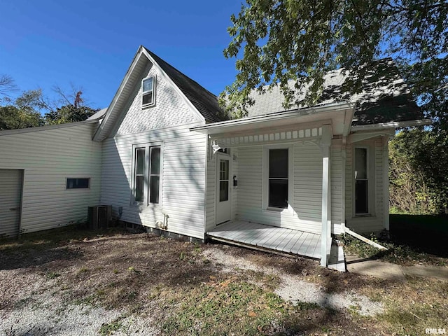 rear view of property featuring cooling unit