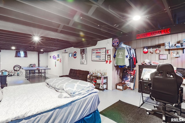 bedroom featuring concrete floors