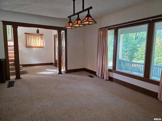 carpeted spare room with a textured ceiling